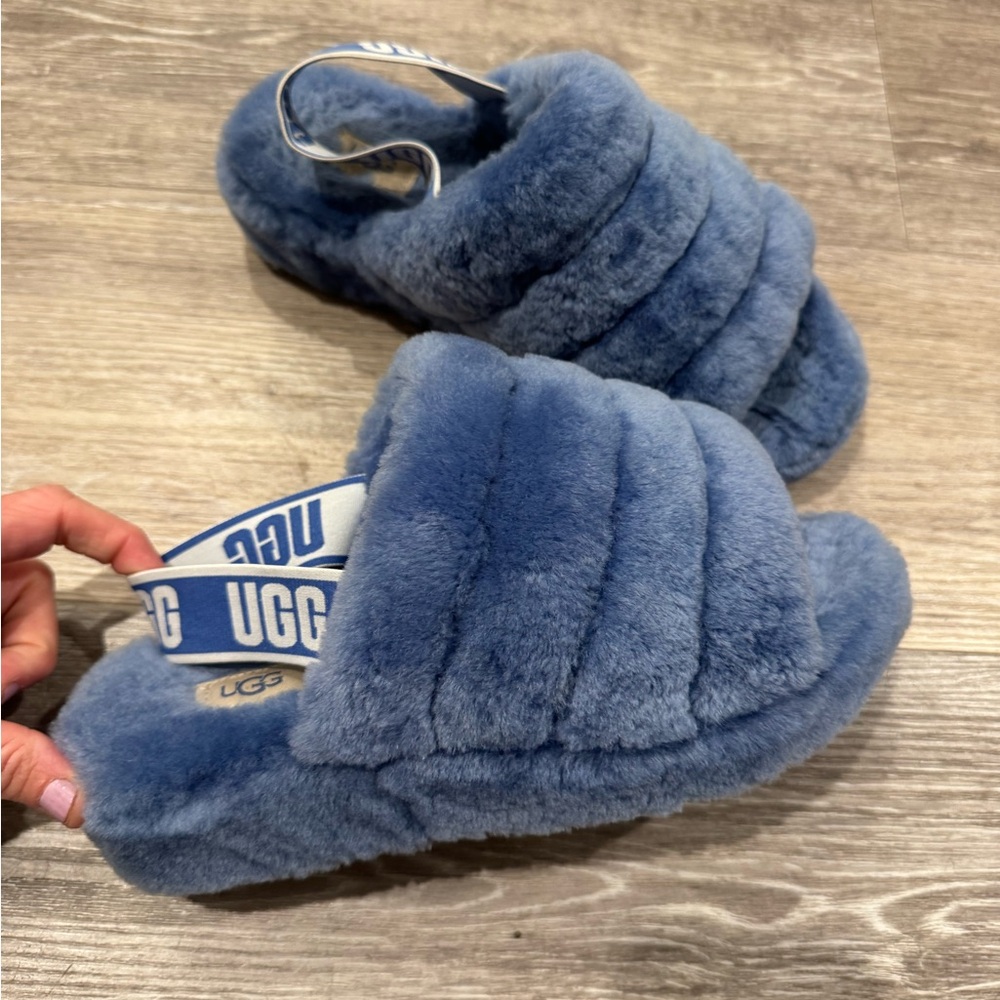 UGG Fluff Yeah slippers in a periwinkle/light blue color.